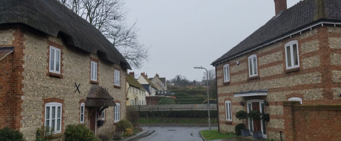 Handsome brick and flint houses at Manor Farm Close, Pimperne