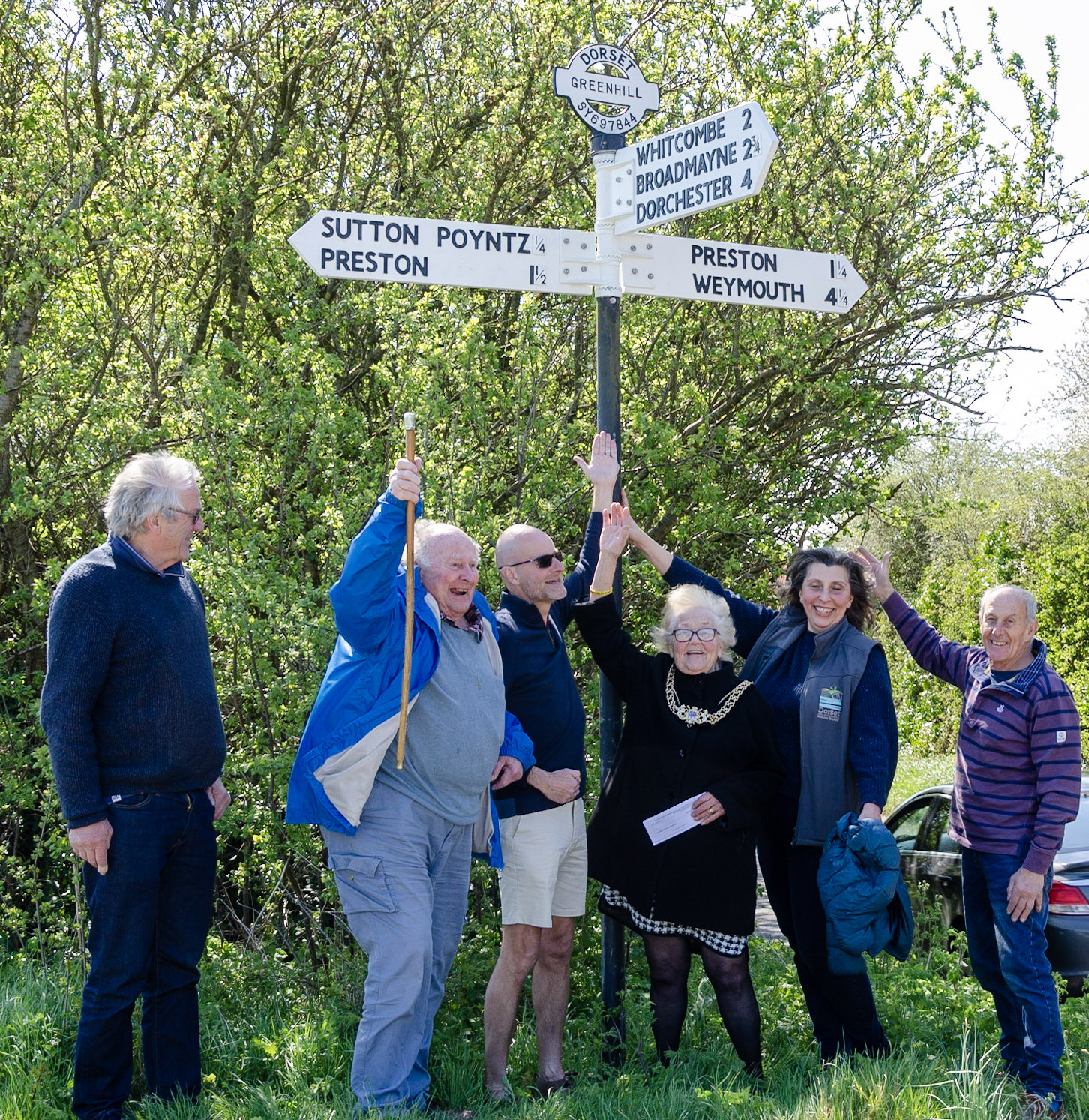 Celebrating reinstatement of damaged fingerpost Greenhill near Sutton Poyntz April 2023